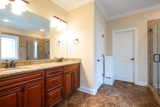 bathroom featuring ornamental molding, vanity, and an enclosed shower