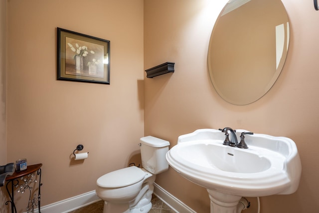 bathroom featuring sink and toilet