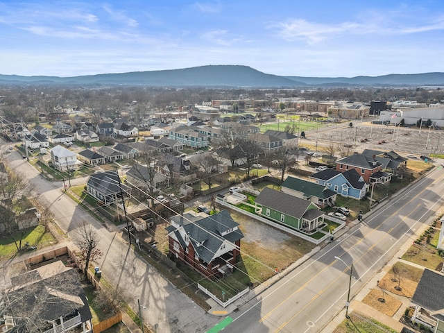 birds eye view of property with a mountain view