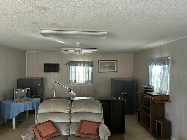 carpeted bedroom featuring black refrigerator, ceiling fan, and a textured ceiling