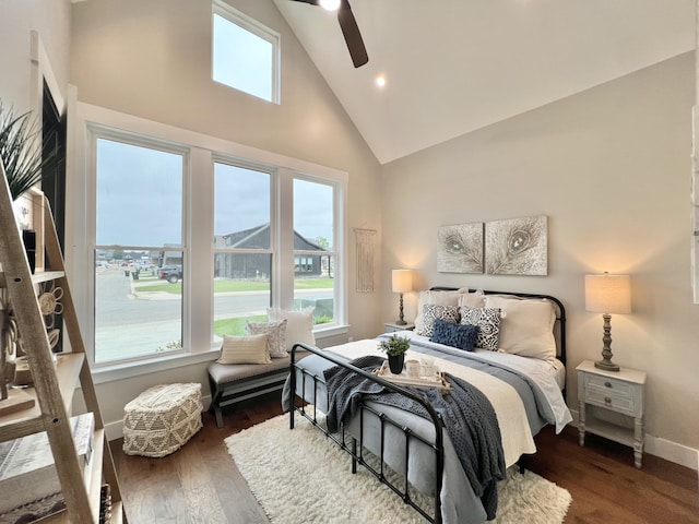 bedroom featuring high vaulted ceiling, wood finished floors, baseboards, recessed lighting, and ceiling fan