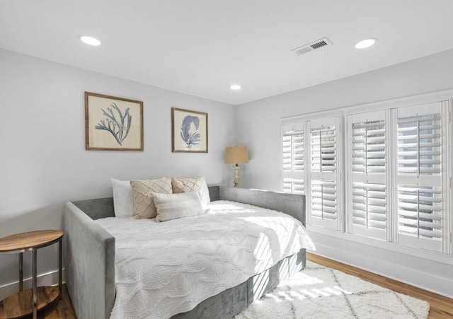 bedroom featuring hardwood / wood-style floors