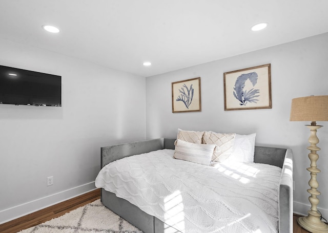 bedroom with dark wood-type flooring