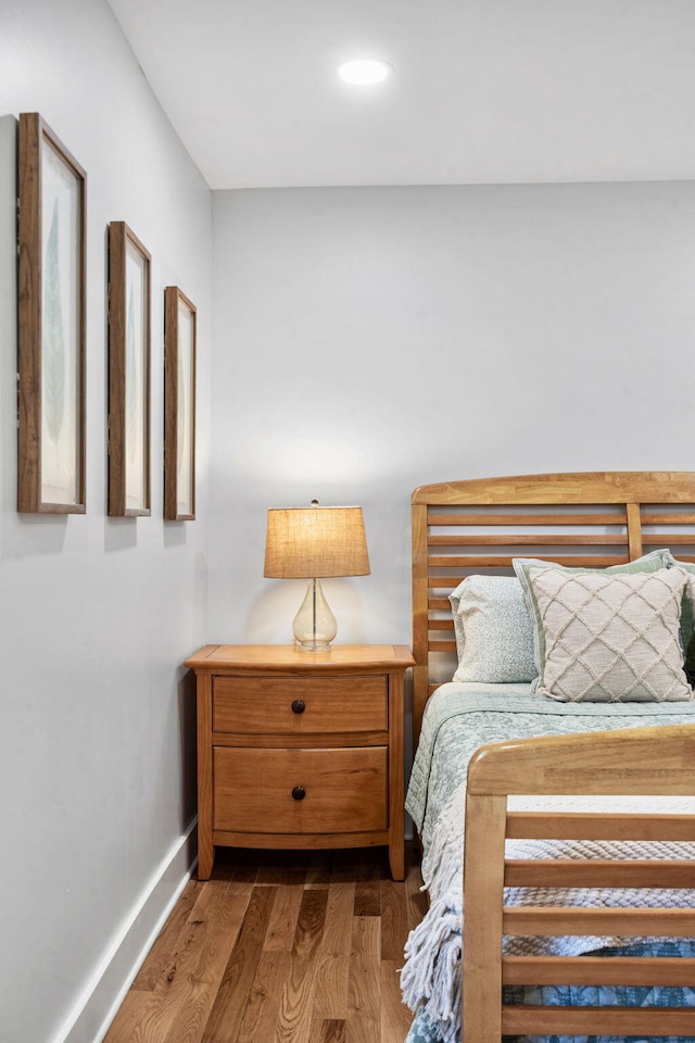 bedroom featuring dark wood-type flooring