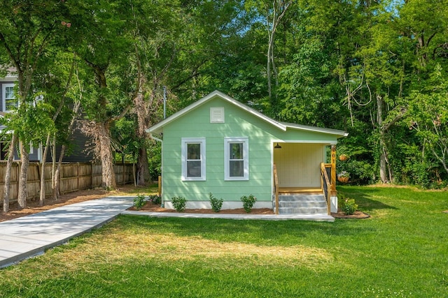 view of outdoor structure with a lawn