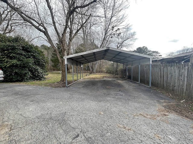 view of parking / parking lot with a carport