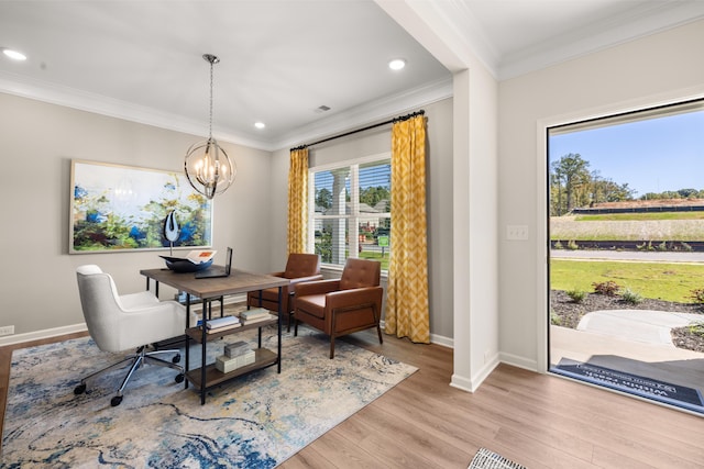 dining space featuring crown molding, an inviting chandelier, and light hardwood / wood-style floors