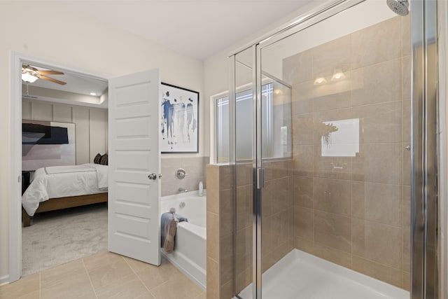 bathroom with ceiling fan, tile patterned floors, and plus walk in shower