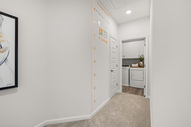 hall featuring independent washer and dryer and carpet flooring