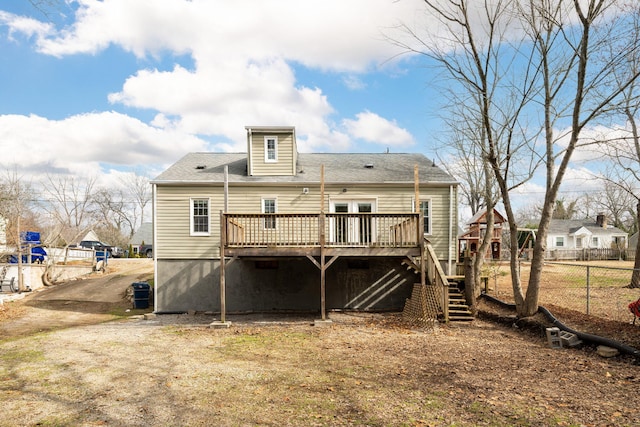 rear view of property with a wooden deck