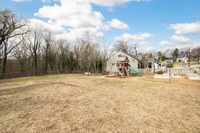 view of playground with a lawn