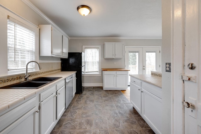 kitchen featuring sink, backsplash, white cabinetry, stainless steel dishwasher, and ornamental molding