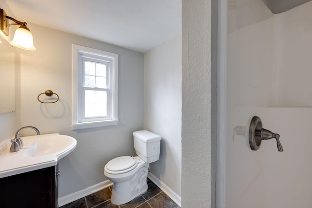 bathroom with toilet and vanity