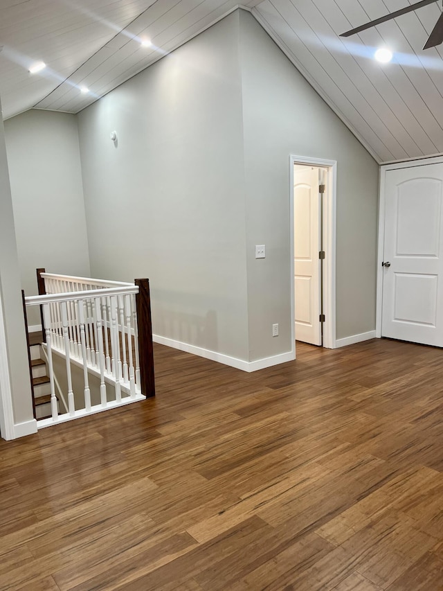 bonus room with vaulted ceiling, baseboards, and wood finished floors