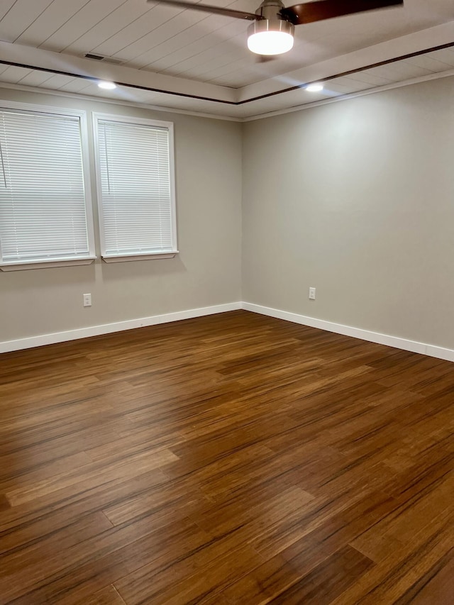 empty room with wood finished floors and baseboards