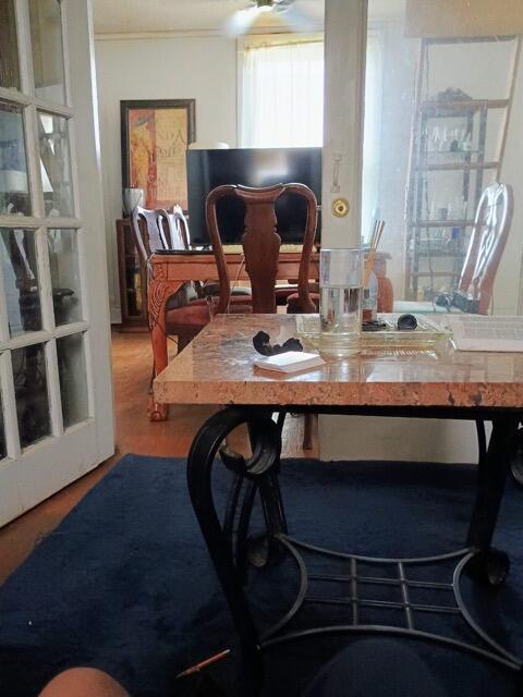 dining space with ornamental molding
