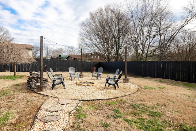 view of yard with a fire pit