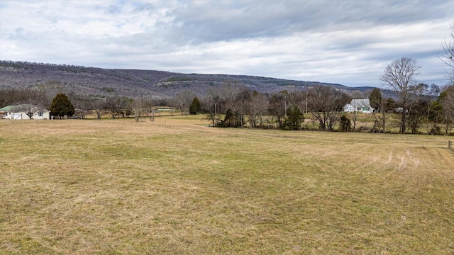 property view of mountains featuring a rural view