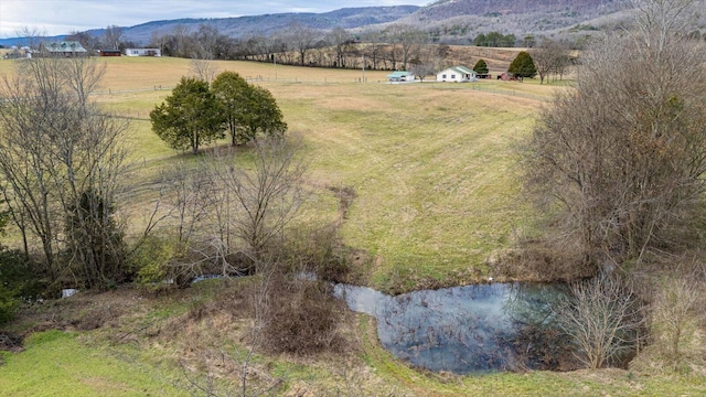 aerial view with a rural view and a water and mountain view