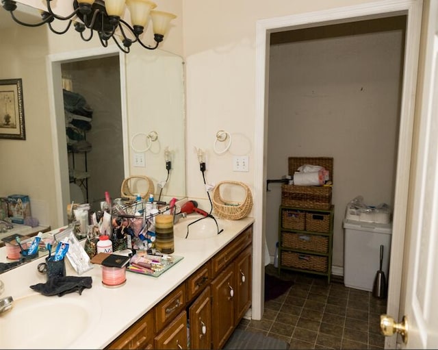 bathroom with vanity and a chandelier