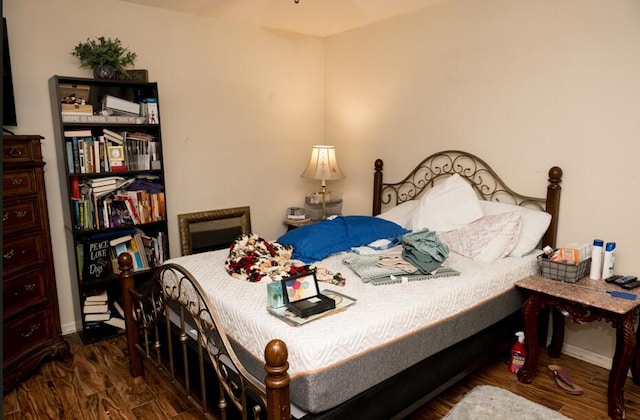 bedroom featuring dark wood-type flooring