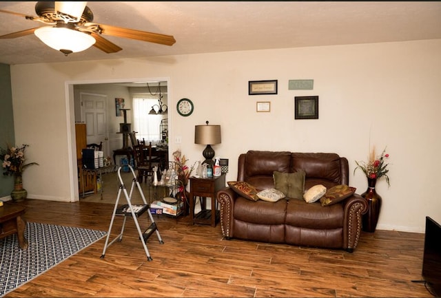 living room with hardwood / wood-style flooring and ceiling fan