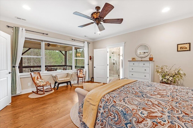 bedroom with light wood finished floors, visible vents, baseboards, connected bathroom, and ceiling fan