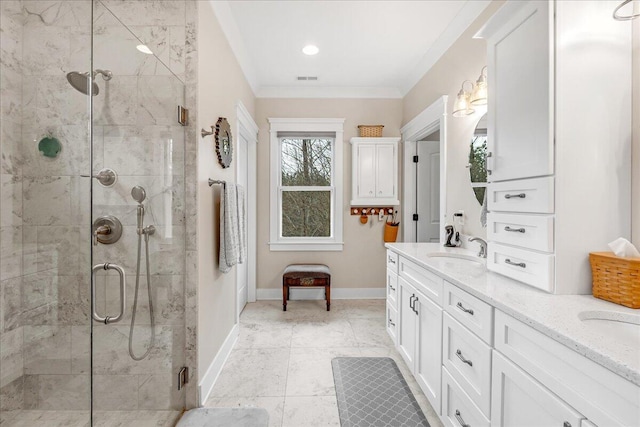 bathroom with visible vents, baseboards, ornamental molding, vanity, and a shower stall