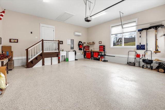 garage featuring an AC wall unit, electric panel, and a garage door opener