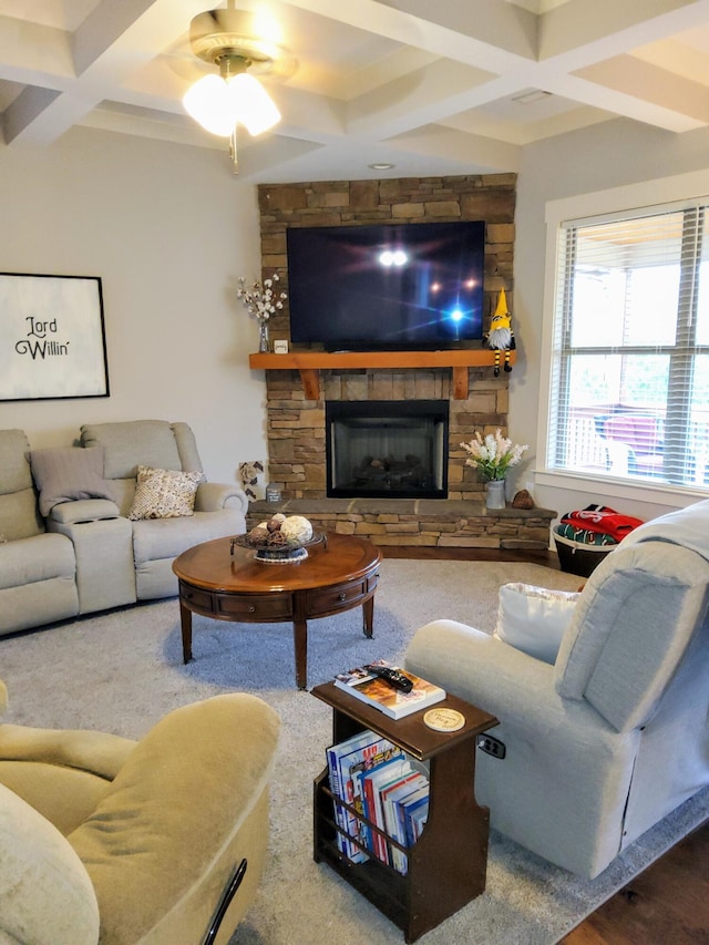 living room with coffered ceiling, beam ceiling, and a fireplace