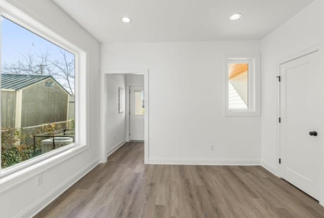 spare room with hardwood / wood-style floors