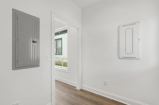 interior space with hardwood / wood-style flooring and electric panel