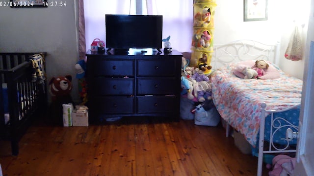 bedroom featuring dark wood-type flooring