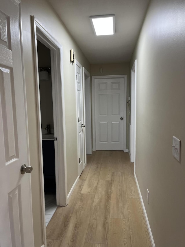 corridor featuring light hardwood / wood-style flooring