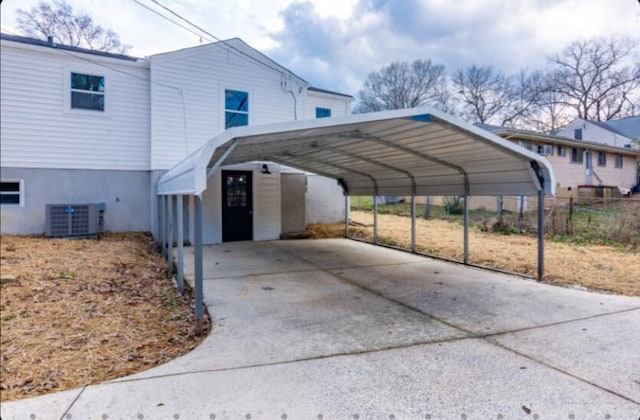 view of vehicle parking featuring a carport