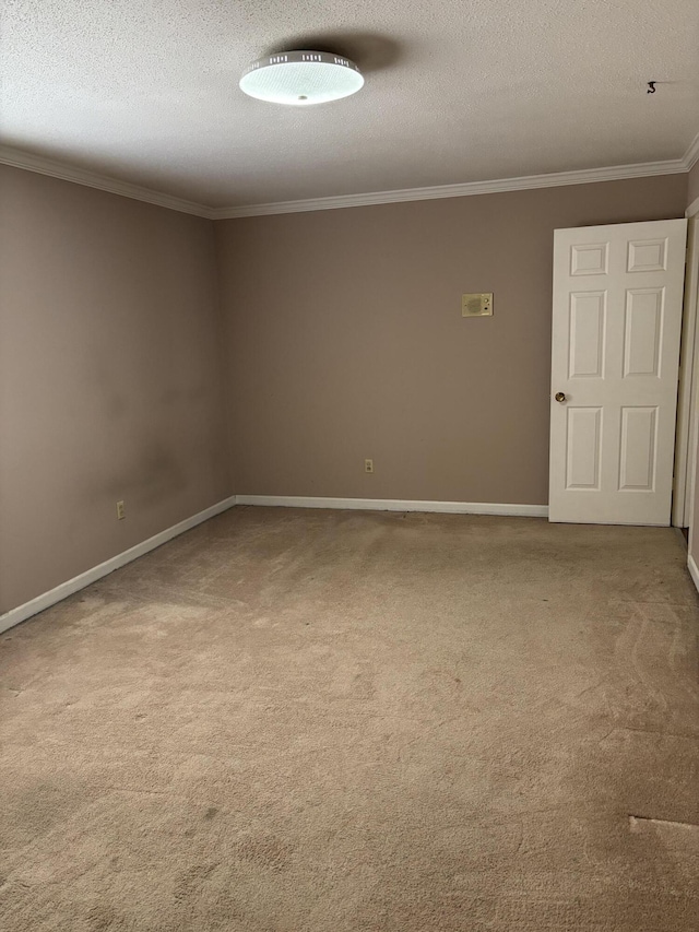 unfurnished room with crown molding, carpet floors, and a textured ceiling