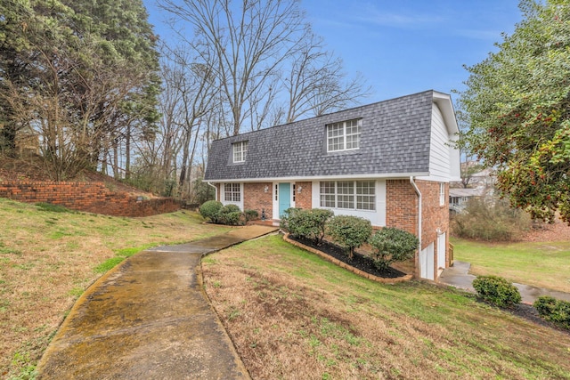 cape cod home with a garage and a front yard