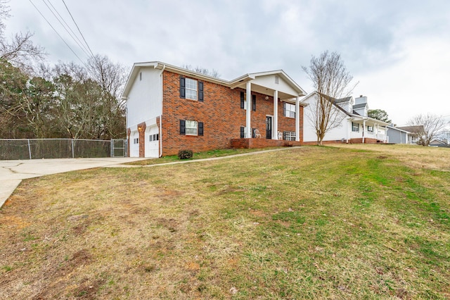 view of front of home with a garage and a front yard