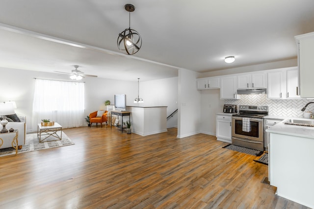 kitchen featuring white cabinets, pendant lighting, and stainless steel range with electric cooktop