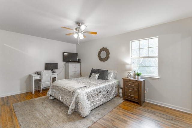 bedroom featuring ceiling fan and hardwood / wood-style floors