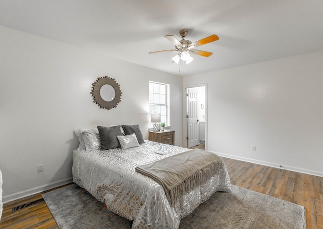 bedroom featuring ceiling fan and dark hardwood / wood-style flooring