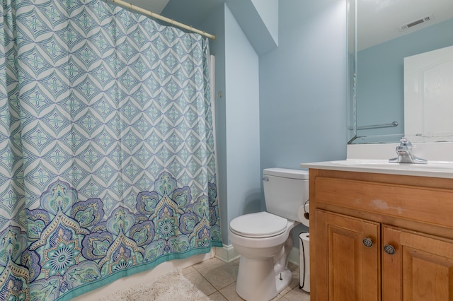 bathroom featuring tile patterned floors, toilet, and vanity