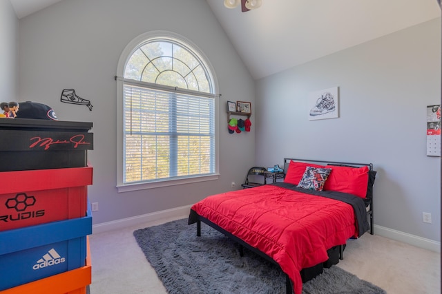 carpeted bedroom featuring lofted ceiling