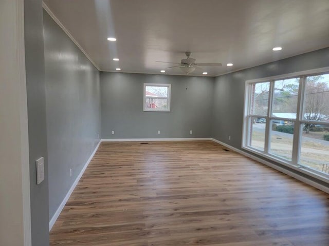 unfurnished room featuring recessed lighting, baseboards, a ceiling fan, and wood finished floors