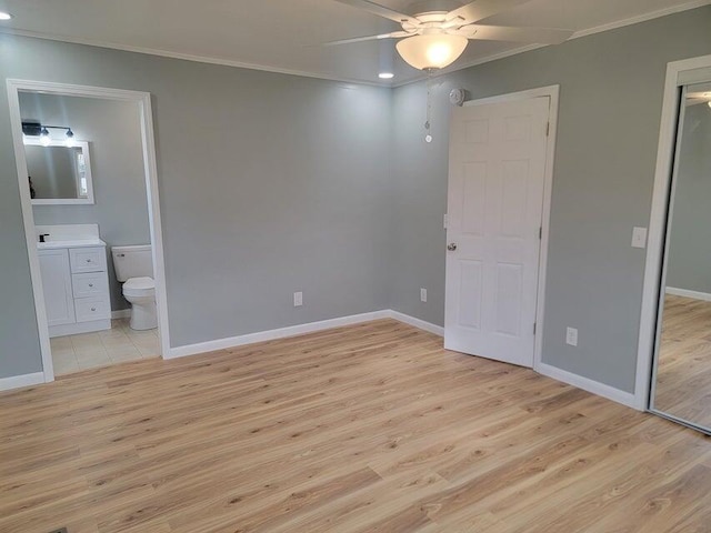 unfurnished bedroom featuring ornamental molding, light wood-style flooring, recessed lighting, and baseboards