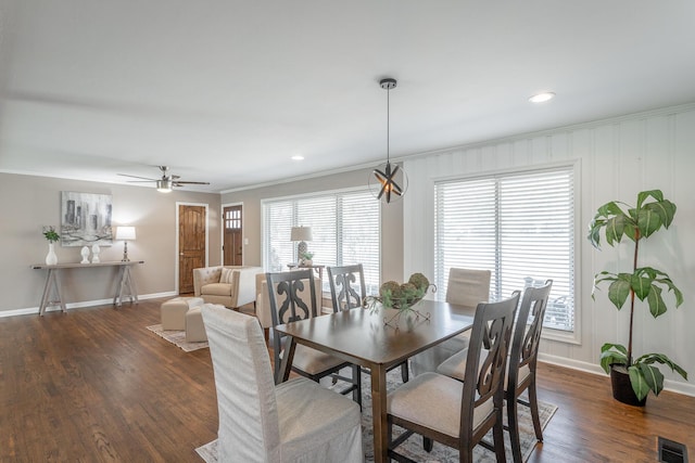 dining room featuring ornamental molding, dark hardwood / wood-style floors, and ceiling fan