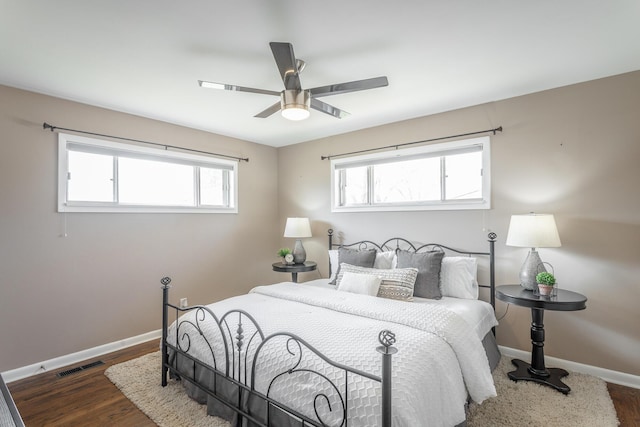 bedroom featuring dark hardwood / wood-style floors and ceiling fan