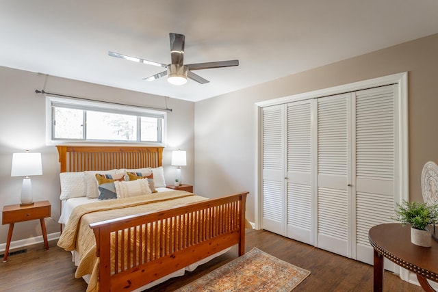 bedroom with ceiling fan, dark hardwood / wood-style flooring, and a closet