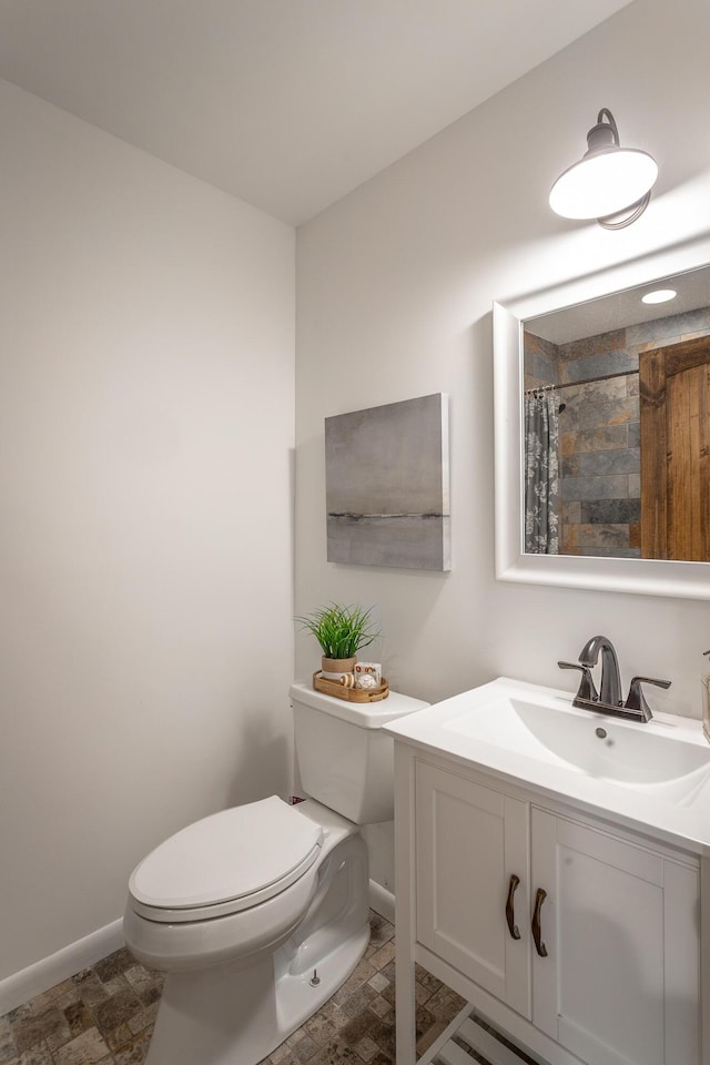 bathroom with vanity, toilet, and a shower with shower curtain