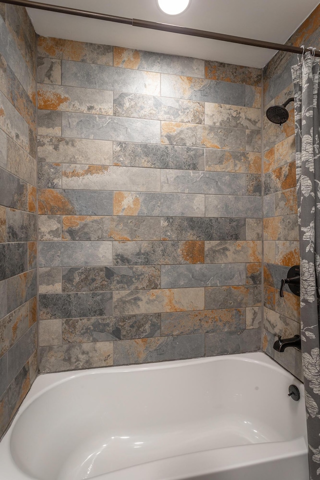 bathroom featuring shower / tub combo with curtain